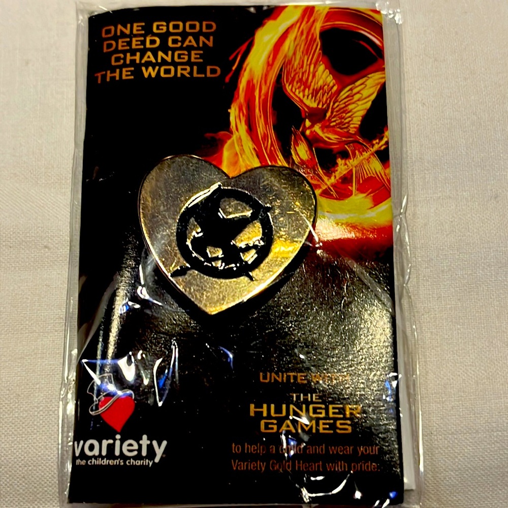 Hunger Games mocking jay pin. United with Variety-the children's charity